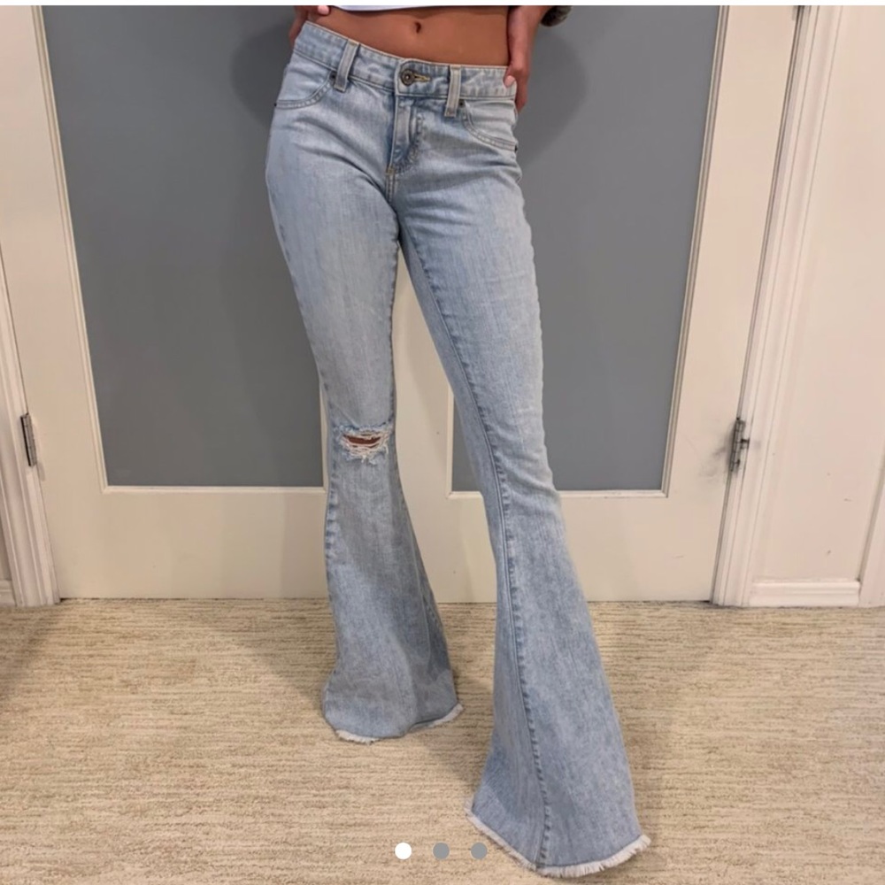 Carmar ripped bell bottom/flare jeans.
